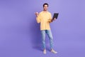 Full body size photo of young guy programmer point finger mockup web developer courses wear yellow shirt isolated violet