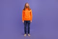 Full body size photo of young handsome blond long hair man wearing orange sweater happy hipster isolated on violet color Royalty Free Stock Photo