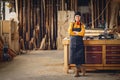 Positive woman working in joinery workshop Royalty Free Stock Photo