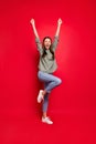 Full body vertical photo of crazy lady raising fists celebrating sports game match victory rejoicing screaming wear Royalty Free Stock Photo