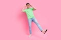 Full body view photo of attractive funky guy dancing have fun touch specs sunglasses discotheque party isolated on pink