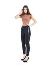 Full body, Young beautiful brunette woman in black pants Royalty Free Stock Photo