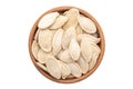 Full bowl of pumpkin seeds isolated on a white background. File contains clipping path Royalty Free Stock Photo