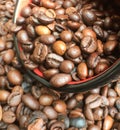 Full bowl of roasted large coffee beans, coffee beans texture background