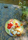 Full breakfast - fried eggs, ketchup, sliced tomato, toasted slice of white bread with slices of butter on a white plate with an Royalty Free Stock Photo