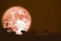 full buck moon planet back silhouette Satellite dishes on roof Royalty Free Stock Photo