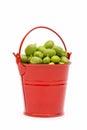 Full bucket of green peas on a white background Royalty Free Stock Photo