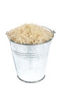 Full bucket of rice grains on a white background
