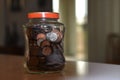 Full coin jar on table