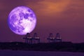 full cold blood moon back on crane of seaport in the night sky