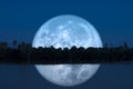 full cold moon back on mountain and reflection on river in the night sky