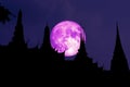 full cold moon on night sky and silhouette top buddhist temple