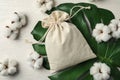 Full cotton eco bag on white wooden table Royalty Free Stock Photo