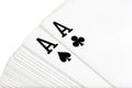 Full deck of playing cards with aces of clubs and spades on top