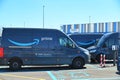 Full electric delivery vans parked at amazon e-commerce company logistic hub