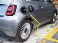 Full electric Fiat 500e car at charging station close view