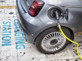 Full electric Fiat 500e car at charging station close view