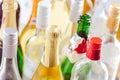 Full and empty bottles of different alcoholic drinks, abuse and alcohol addiction Royalty Free Stock Photo