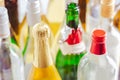 Full and empty bottles of different alcoholic drinks, abuse and alcohol addiction Royalty Free Stock Photo