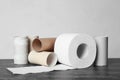 Full and empty toilet paper rolls on table Royalty Free Stock Photo