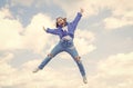 full of energy. childhood happiness. teen girl jumping high in the sky. having a party fun. Autumn style. Happy kid wear Royalty Free Stock Photo