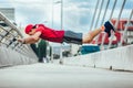 Young man extreme exercising on the bridge Royalty Free Stock Photo