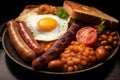 English breakfast, consisting of bacon, fried egg, sausage, mushrooms, baked beans, toast, hash brown and grilled tomatoes Royalty Free Stock Photo