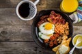 Full english breakfast - eggs, bacon, beans, toast, coffee and juice Royalty Free Stock Photo