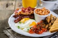 Full english breakfast - eggs, bacon, beans, toast, coffee and juice Royalty Free Stock Photo