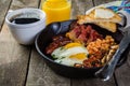 Full english breakfast - eggs, bacon, beans, toast, coffee and juice Royalty Free Stock Photo