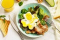 Full  English breakfast - fried egg, fried bacon, spinach, arugula, avocado, toast and orange juice Royalty Free Stock Photo