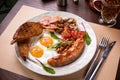 Full English breakfast - fried egg, baked beans, bacon, sausages