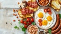 Full English Breakfast including sausages, grilled tomatoes and mushrooms, egg, bacon, baked beans and bread. Royalty Free Stock Photo