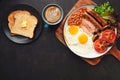 Full English Breakfast with Latte Art on dark table Royalty Free Stock Photo