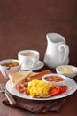 Full english breakfast with scrambled eggs, bacon, sausage, bean Royalty Free Stock Photo