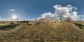 Full 360 equirectangular equidistant spherical panorama as background. Approaching storm on the ruined military fortress of the