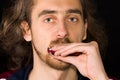 Full face portrait of man playing harmonica Royalty Free Stock Photo