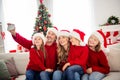 Full family x-mas vacation. People mommy mom daddy dad three preteen small kids sit sofa make selfie cellphone in house Royalty Free Stock Photo