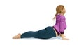 Full-figured blonde woman in cobra pose yoga
