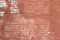 Artsy looking old salmon color painted brick wall texture with deterioration