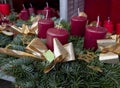 full frame Advent wreath with four red candles and a golden ribbon. Royalty Free Stock Photo