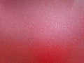 background of red shagreen powder paint coating on flat sheet steel surface Royalty Free Stock Photo