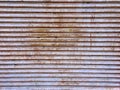 Full Frame Background of Old Grungy Corrugated Metal Door