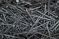 Full frame background showing lots of metallic nails. Close up of carpentry shiny nails background
