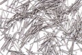 Full frame background showing lots of metallic nails on white