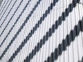 Background of Striped Shadows on White Corrugated Wall