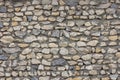 full frame background and texture of ugly sharp stone wall with concrete between rocks Royalty Free Stock Photo