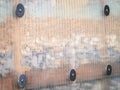 Full frame background of textured polycarbonate wall with rocks inside