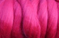 Full frame close up of pink red ball raw merino wool Royalty Free Stock Photo