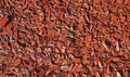 Full frame closeup of brown red bark mulch for cover of garden bed Royalty Free Stock Photo